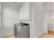 Laundry room with modern washer and dryer and storage cabinets at 172 Mary Ellen Dr, Charleston, SC 29403