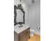 Powder room featuring decorative mirror, marble countertop and modern toilet at 172 Mary Ellen Dr, Charleston, SC 29403