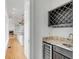 Elegant wet bar with granite countertop, wine rack and beverage cooler in a bright open space at 172 Mary Ellen Dr, Charleston, SC 29403