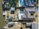 Expansive aerial view of a waterfront home with a private pool and boat dock for convenient water access at 1886 Capri Dr, Charleston, SC 29407