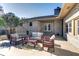 Enjoy the back patio with its comfortable seating and nice views of the house's brick exterior and backyard at 1886 Capri Dr, Charleston, SC 29407