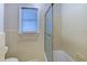 Bathroom features tiled walls and flooring, tub shower combo, and window with blinds at 1886 Capri Dr, Charleston, SC 29407