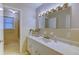 Bathroom features an elongated vanity, stylish lighting, and a shower with glass door at 1886 Capri Dr, Charleston, SC 29407