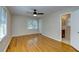 Bedroom features hardwood floors, two windows, and access to an en-suite bathroom at 1886 Capri Dr, Charleston, SC 29407