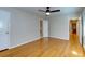 Bedroom features ceiling fan, hardwood floors, and access to an en-suite bathroom at 1886 Capri Dr, Charleston, SC 29407