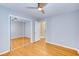Bedroom features hardwood floors, modern ceiling fan, and a closet with mirror doors at 1886 Capri Dr, Charleston, SC 29407