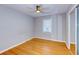 Bedroom features hardwood floors, modern ceiling fan, and large closet with sliding doors at 1886 Capri Dr, Charleston, SC 29407