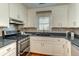 Well-lit kitchen with stainless steel appliances and plenty of cabinet storage at 1886 Capri Dr, Charleston, SC 29407