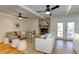 Inviting living room features hardwood floors, a fireplace, and French doors that open to the patio at 1886 Capri Dr, Charleston, SC 29407