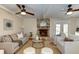 Comfortable living room features hardwood floors, a brick fireplace, and neutral tones for a relaxing ambiance at 1886 Capri Dr, Charleston, SC 29407