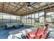 Covered, screened patio with an outdoor sectional and lots of natural light at 1886 Capri Dr, Charleston, SC 29407