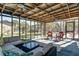 Enclosed patio with a ceiling fan, exterior furniture, and lots of natural light at 1886 Capri Dr, Charleston, SC 29407