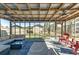Bright screened patio featuring an outdoor sectional, ceiling fans, and backyard views at 1886 Capri Dr, Charleston, SC 29407