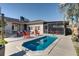 Outdoor swimming pool with a patio and screened-in porch provides a relaxing outdoor experience at 1886 Capri Dr, Charleston, SC 29407