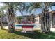 Relaxing backyard pool with patio seating, perfect for outdoor entertaining surrounded by palm trees at 1886 Capri Dr, Charleston, SC 29407