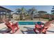 Backyard oasis with private swimming pool and comfortable outdoor furniture, palm trees at 1886 Capri Dr, Charleston, SC 29407