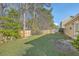 A view of the large back yard and fence, with grass and trees at 191 Blackstone Dr, Moncks Corner, SC 29461