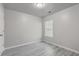 This bedroom features a window, ceiling light, and light gray walls at 191 Blackstone Dr, Moncks Corner, SC 29461