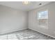 A well-lit bedroom featuring modern flooring, fresh paint, and a large window at 191 Blackstone Dr, Moncks Corner, SC 29461