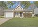 Charming single-story home with a well-manicured lawn and attached one car garage at 191 Blackstone Dr, Moncks Corner, SC 29461