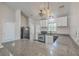 Well-equipped kitchen featuring granite countertops, a black oven, and ample white cabinetry at 191 Blackstone Dr, Moncks Corner, SC 29461