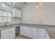 A functional kitchen showcasing white cabinets, granite counters, and essential appliances at 191 Blackstone Dr, Moncks Corner, SC 29461