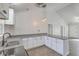 Bright kitchen features shaker cabinets, granite countertops, and modern lighting fixtures at 191 Blackstone Dr, Moncks Corner, SC 29461