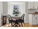 Cozy dining nook bathed in natural light, featuring a round table and window at 203 Horseshoe Rd, Moncks Corner, SC 29461