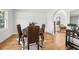 Cozy dining area with wicker chairs, wood floors, and natural light at 203 Horseshoe Rd, Moncks Corner, SC 29461