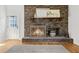 Classic brick fireplace featuring detailed screen, mantle, and decor at 203 Horseshoe Rd, Moncks Corner, SC 29461