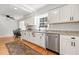 Bright kitchen with stainless steel dishwasher, granite countertops, and a cozy dining nook at 203 Horseshoe Rd, Moncks Corner, SC 29461