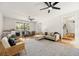 Spacious living room featuring a large rug, stylish seating, and lots of natural light at 203 Horseshoe Rd, Moncks Corner, SC 29461