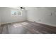 Open living room with hardwood floors and large window at 203 Horseshoe Rd, Moncks Corner, SC 29461