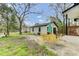 Backyard featuring patio area, garage and fire pit at 204 Delano St, Saint George, SC 29477