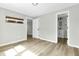Spacious bedroom with new wood flooring, bathroom access and a hanging shelf at 204 Delano St, Saint George, SC 29477