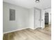 Bright, airy bedroom featuring neutral walls, modern lighting and wood-look flooring at 204 Delano St, Saint George, SC 29477