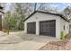 Garage with dark doors, brick exterior and access to backyard at 204 Delano St, Saint George, SC 29477