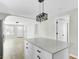 Bright kitchen island with an industrial black hanging light fixture at 204 Delano St, Saint George, SC 29477