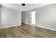 Open living space with new wood flooring and neutral paint at 204 Delano St, Saint George, SC 29477