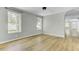Spacious living room with new wood flooring and natural light at 204 Delano St, Saint George, SC 29477