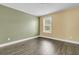Simple bedroom with wood flooring and window at 233 Old Carolina Dr, Goose Creek, SC 29445