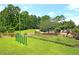 A scenic view of the community with walking path, playground, and bike rack at 233 Old Carolina Dr, Goose Creek, SC 29445