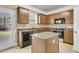 Well-equipped kitchen featuring wood cabinets, granite countertops, and stainless steel appliances at 233 Old Carolina Dr, Goose Creek, SC 29445