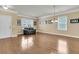 Spacious living area with hardwood floors, ample natural light, and stylish furnishings for comfortable living at 233 Old Carolina Dr, Goose Creek, SC 29445