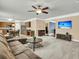 Open-concept living room showcasing a kitchen, breakfast bar, and comfortable lounge area at 233 Old Carolina Dr, Goose Creek, SC 29445