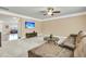 Cozy living room featuring plush carpeting, a ceiling fan, and a large sectional sofa at 233 Old Carolina Dr, Goose Creek, SC 29445