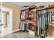 Well-organized walk-in closet with wooden shelving and racks at 233 Old Carolina Dr, Goose Creek, SC 29445