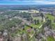 Breathtaking aerial view captures a home with surrounding trees, grassy lawns, and private driveway at 242 Weathers Farm Rd, Bowman, SC 29018
