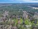 Aerial view showing a house surrounded by lush forest land at 242 Weathers Farm Rd, Bowman, SC 29018