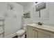 Bright bathroom with a white vanity, toilet, and decorative shelving for storage, creating a clean and functional space at 242 Weathers Farm Rd, Bowman, SC 29018